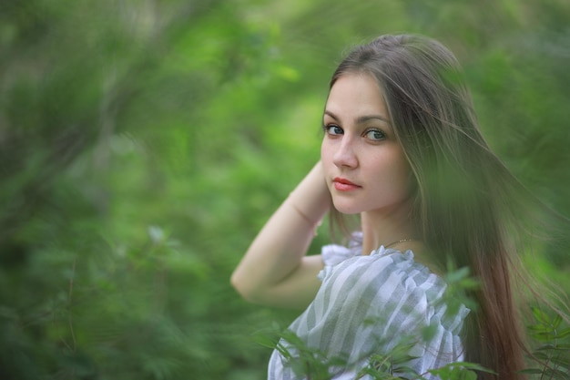 A girl in a spring green park