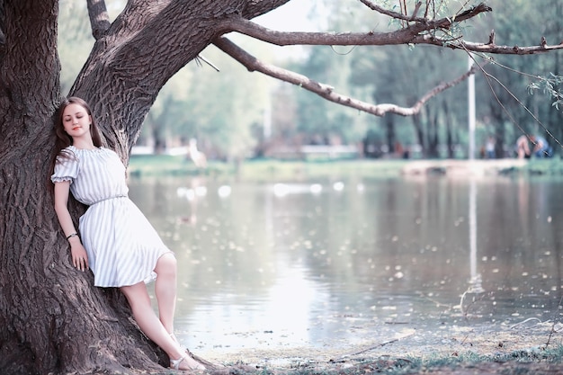 A girl in a spring green park