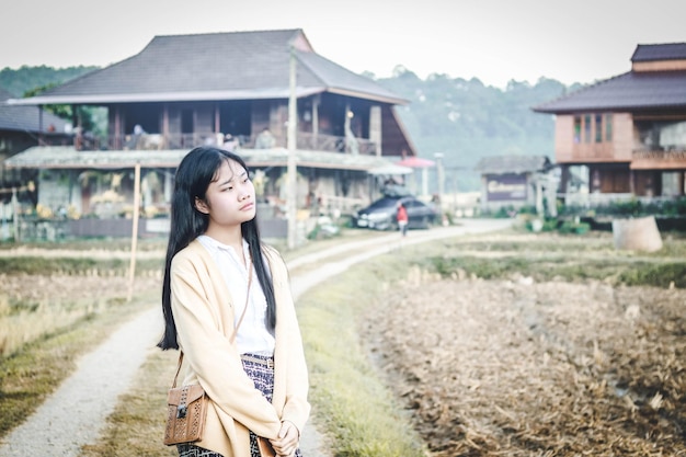 Girl standing in the countryside morning