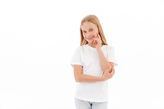 Girl standing posing isolated on white wall.