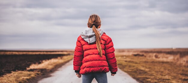 Girl standing on the road