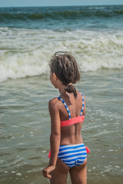 Girl standing in sea