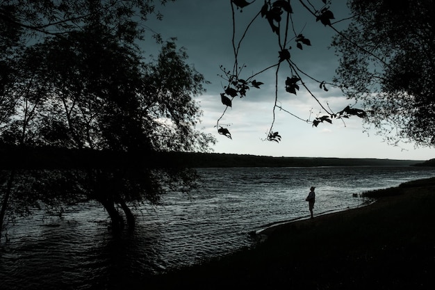 A girl stands on the bank during the flood of the Oka River between Tarusa and Serpukhov