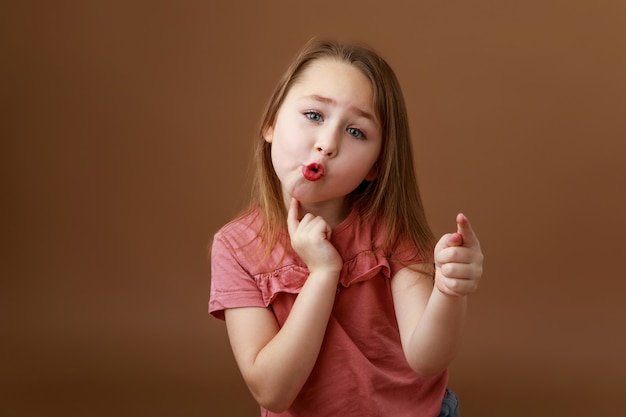 Girl stretching her lips while pronouncing sounds