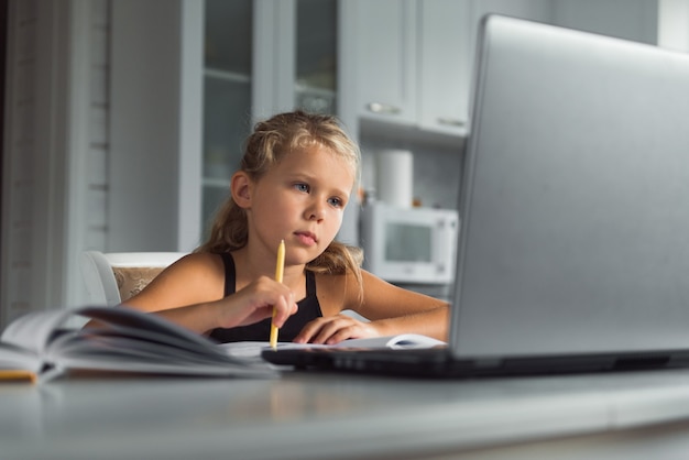 girl student study at home with laptop