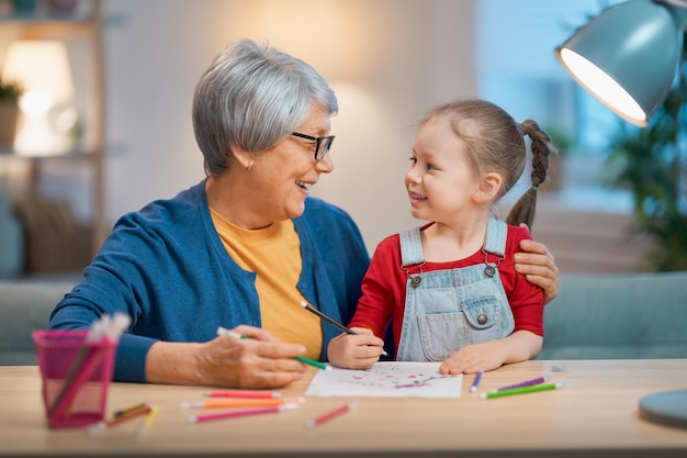 Girl studying with grandma