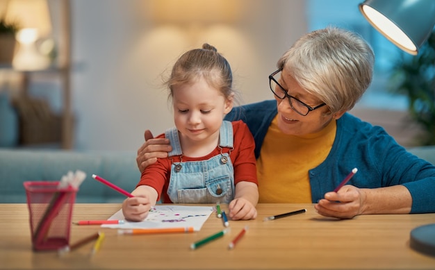 Girl studying with grandma