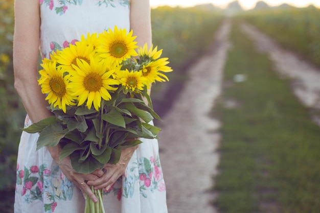 Girl and sunflowers