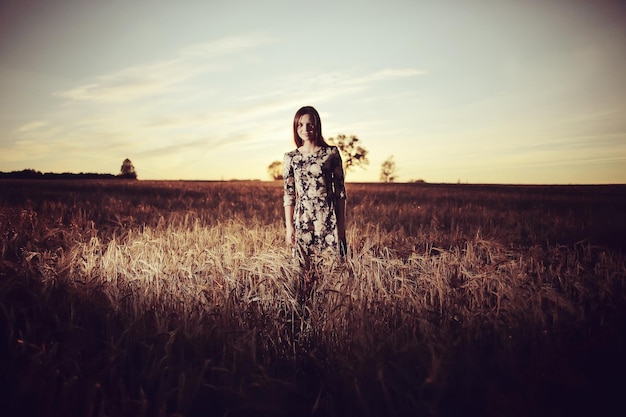 girl sunset in the rustic landscape of wheat