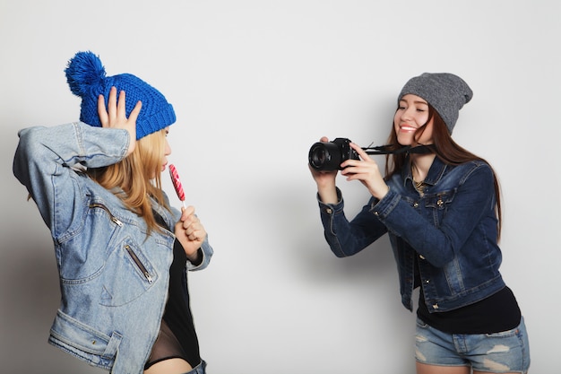 A girl takes picture of her friend