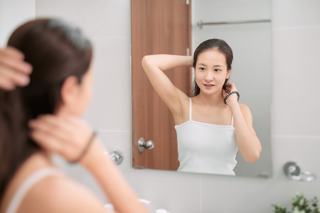 Girl taking care refreshing her hairstyle