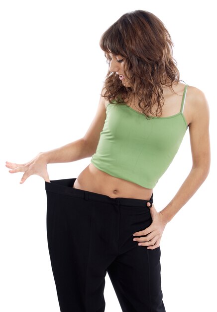 Girl taking measurements over a white background