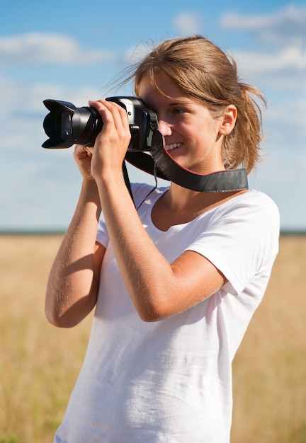 girl taking photo with camera