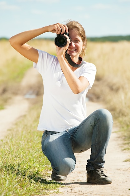 girl taking photo with camera