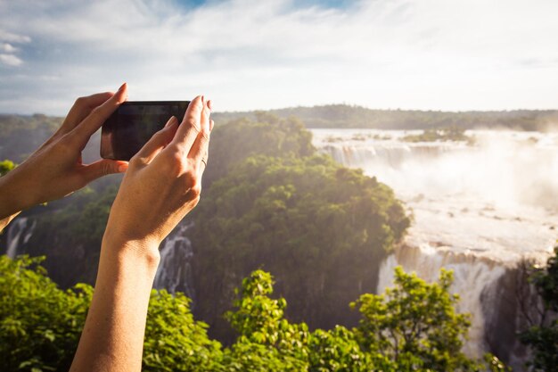 Girl taking a photo with smartphone