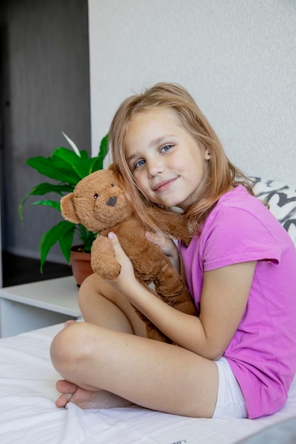 a girl and a teddy bear