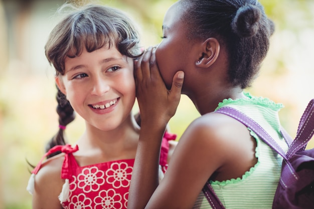 Girl telling a secret