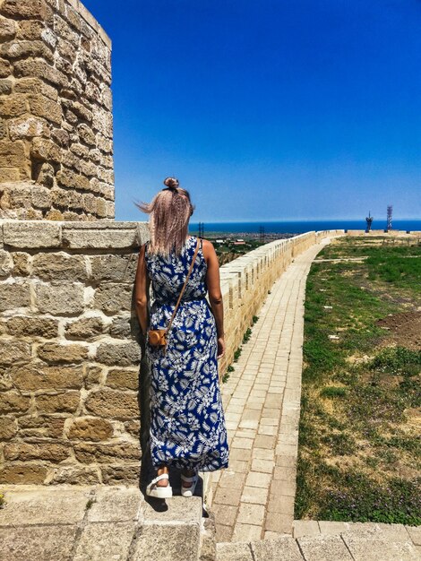 A girl on the territory of the NarynKala Fortress in Derbent Dagestan Russia June 2021