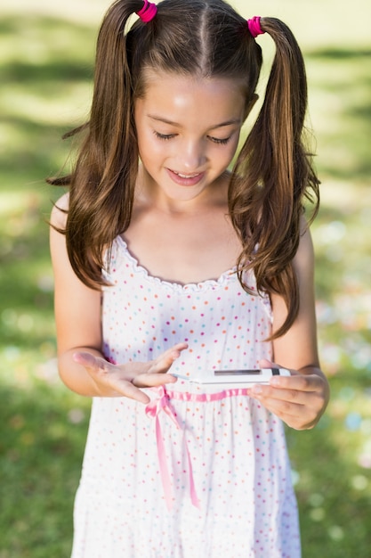 Photo girl testing diabetes on glucose meter