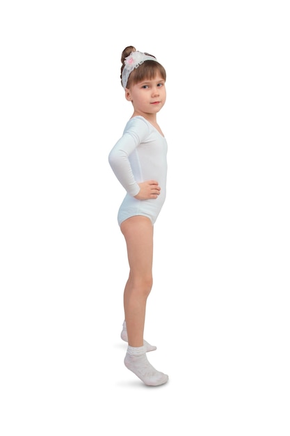 Girl in tights and pointe posing sideways on an isolated white surface