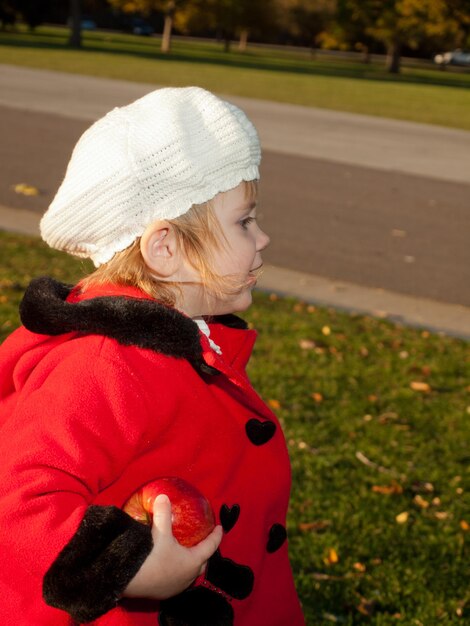 Girl toddler in autumn park.