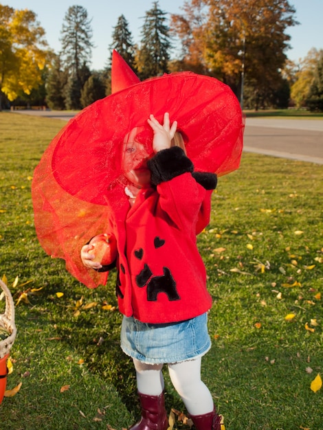 Girl toddler in autumn park.