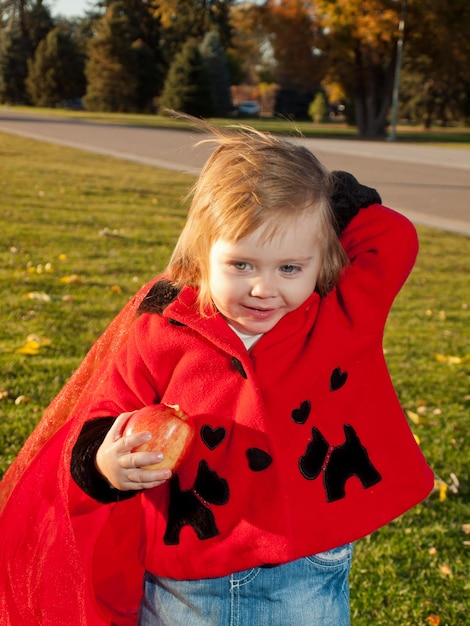 Girl toddler in autumn park.