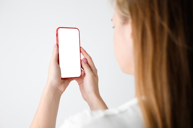 Girl touching a screen of her smarthone Horizontal