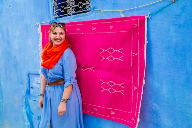 Girl tourist in the famous blue city.