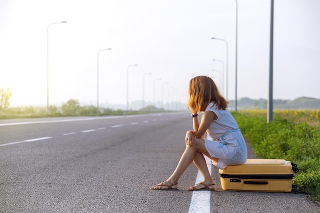 Girl traveler and suitcase