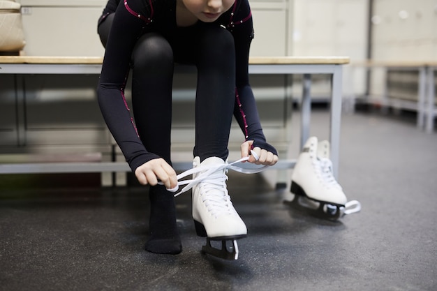 Girl Tying Ice Skates