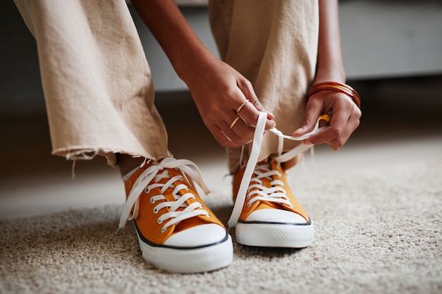 Girl Tying Shoes Close Up