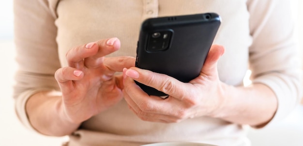 Girl using black smartphone