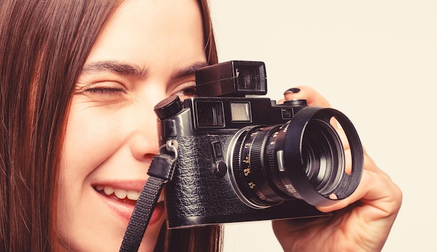 Girl using a camera photo. Photographer camera photo, photographing girl joy make photography taking concept. Girl with a cameras. Woman holding camera