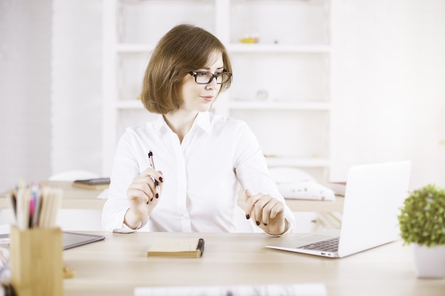 Girl using laptop in office