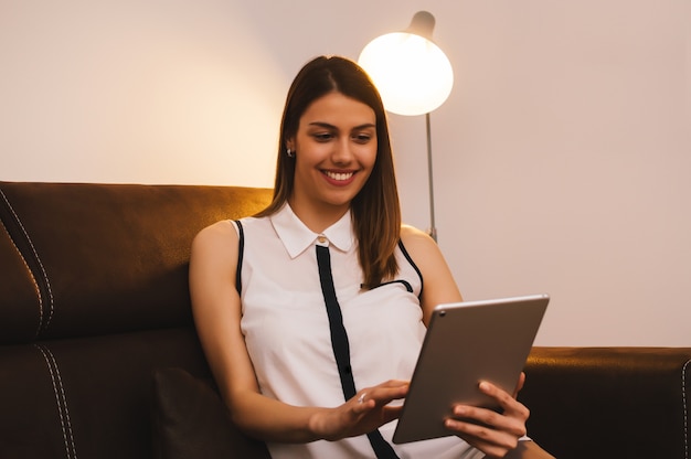 Girl using tablet computer at home