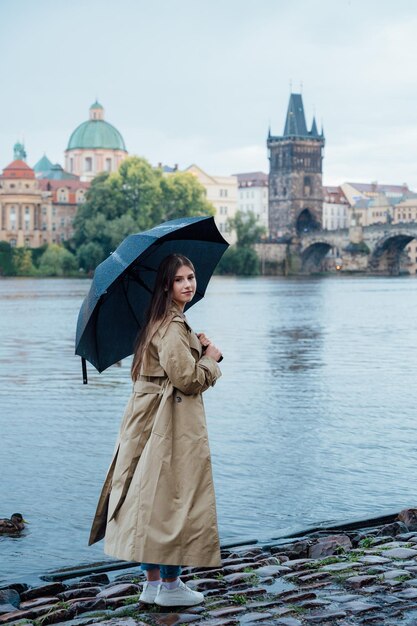 A girl in Vltava river in Prague View of the Vltava River and Charles Bridge