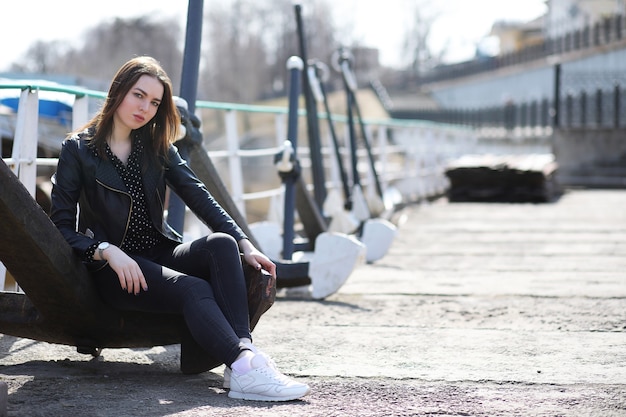 Girl on a walk through the spring city on a sunny day