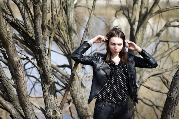 Girl on a walk through the spring city on a sunny day