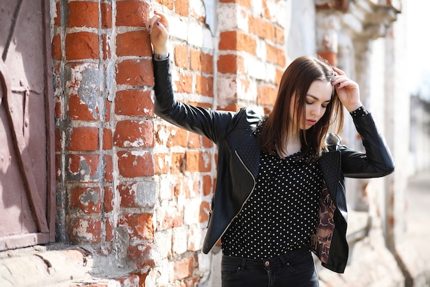 Girl on a walk through the spring city on a sunny day