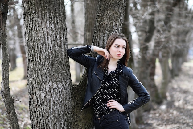 Girl on a walk through the spring city on a sunny day