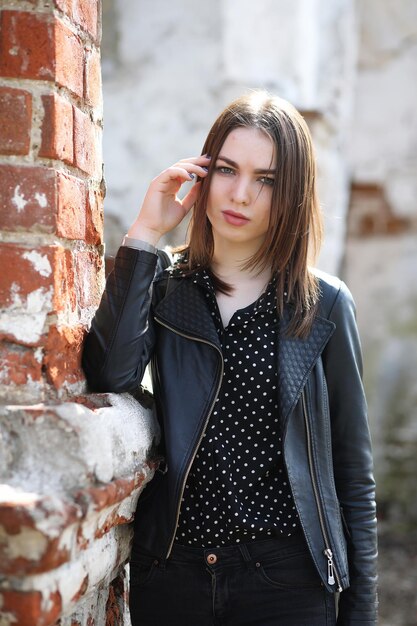 Girl on a walk through the spring city on a sunny day