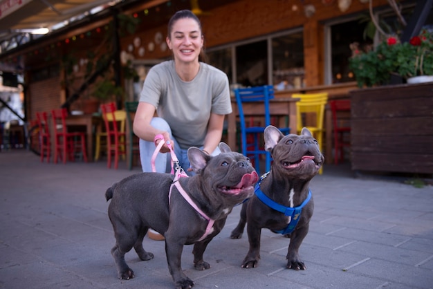 Girl walking the dogs outside