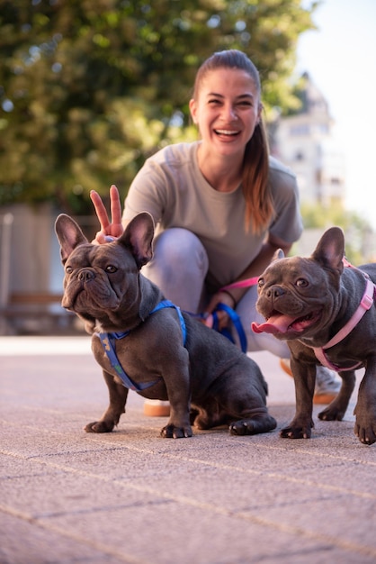 Girl walking the dogs outside