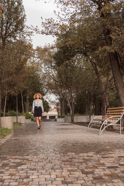 Girl walking under rain in hot summer day