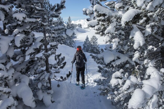 Girl walking with snowshoes