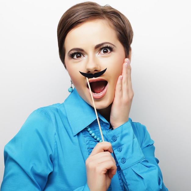 Girl wearing fake mustaches