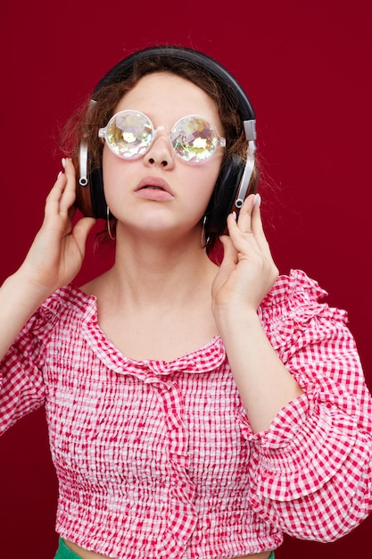 Girl wearing headphones glasses in the form of a diamond closeup unaltered