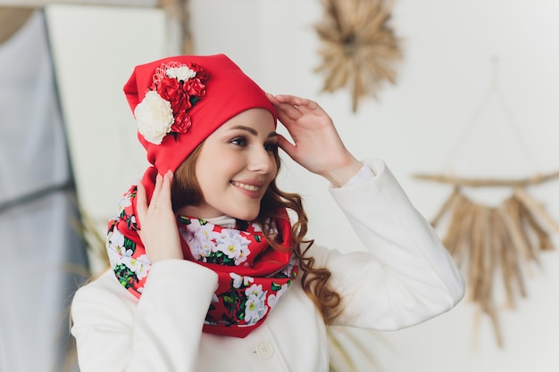 Girl wearing knitted warm hat, coat and scarf