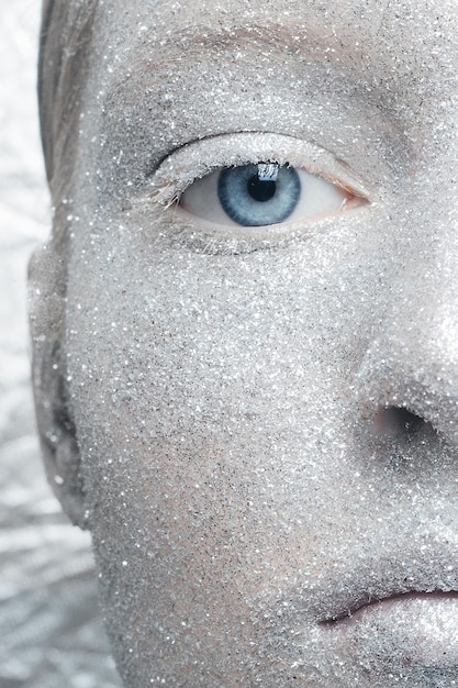 Girl wearing silver glitter makeup